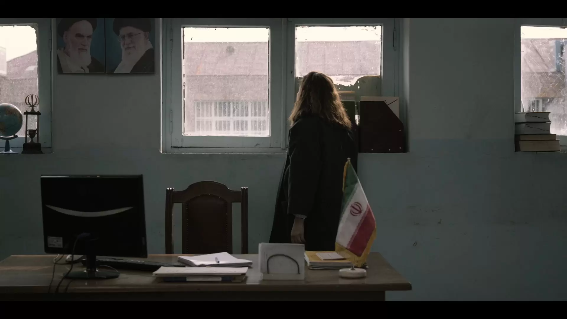 Simin standing in a government office